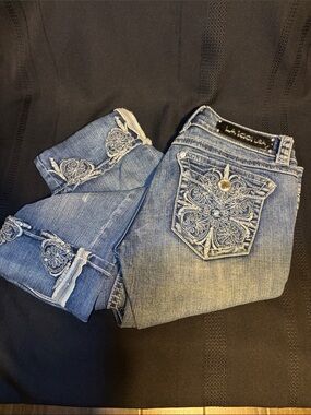 L.A. Idol Embroidered Medium Blue Capri Jeans with slight wear on leather patch.